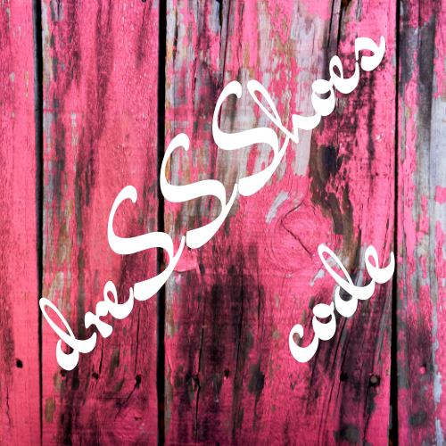 The image is a close-up of a weathered wooden surface with a pink and black color scheme. The text "dooShoes code" is written in cursive on the surface, creating a visually striking contrast against the wood.