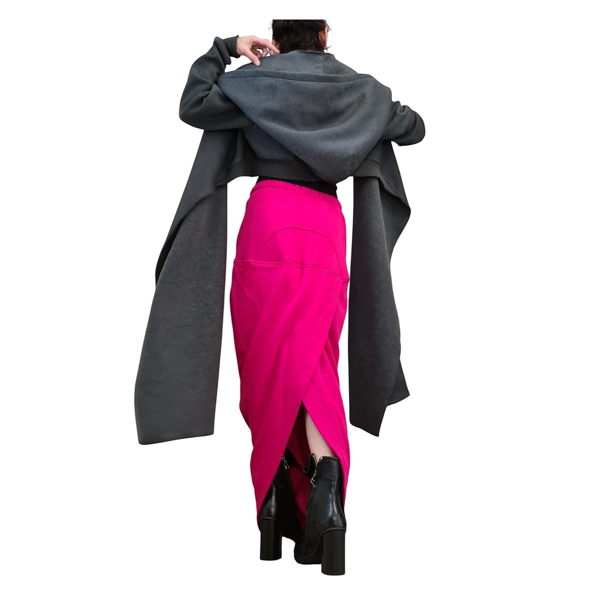 dreSSShoescode hot pink cotton blend asymmetric maxi skirt with a high slit, paired with a grey hooded cardigan.
